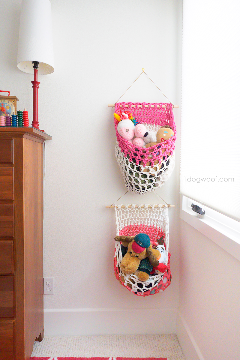 Fabric or t-shirt yarn hanging baskets for a kids room.