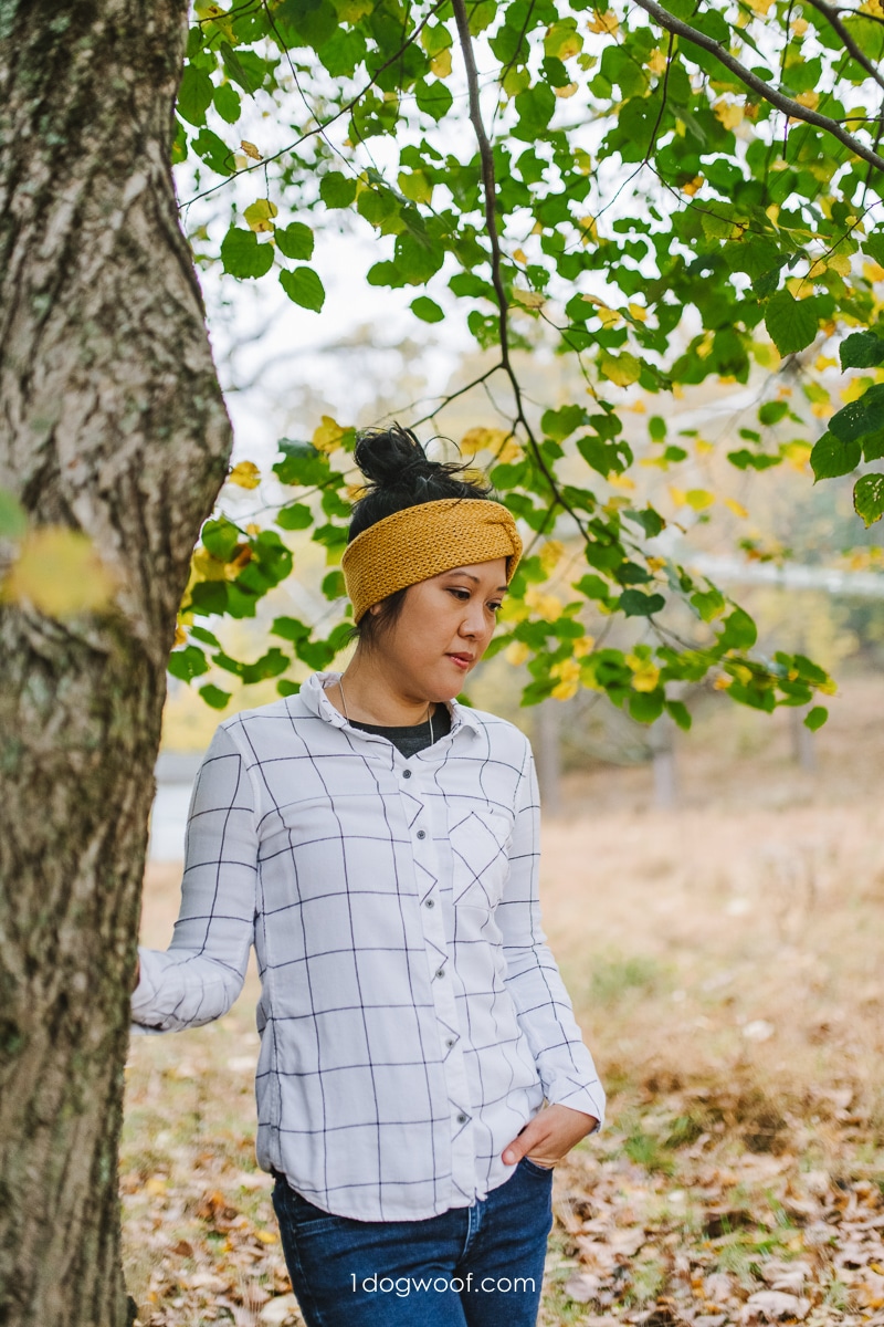 woman standing next to tree wearing yellow tunisian crochet headband