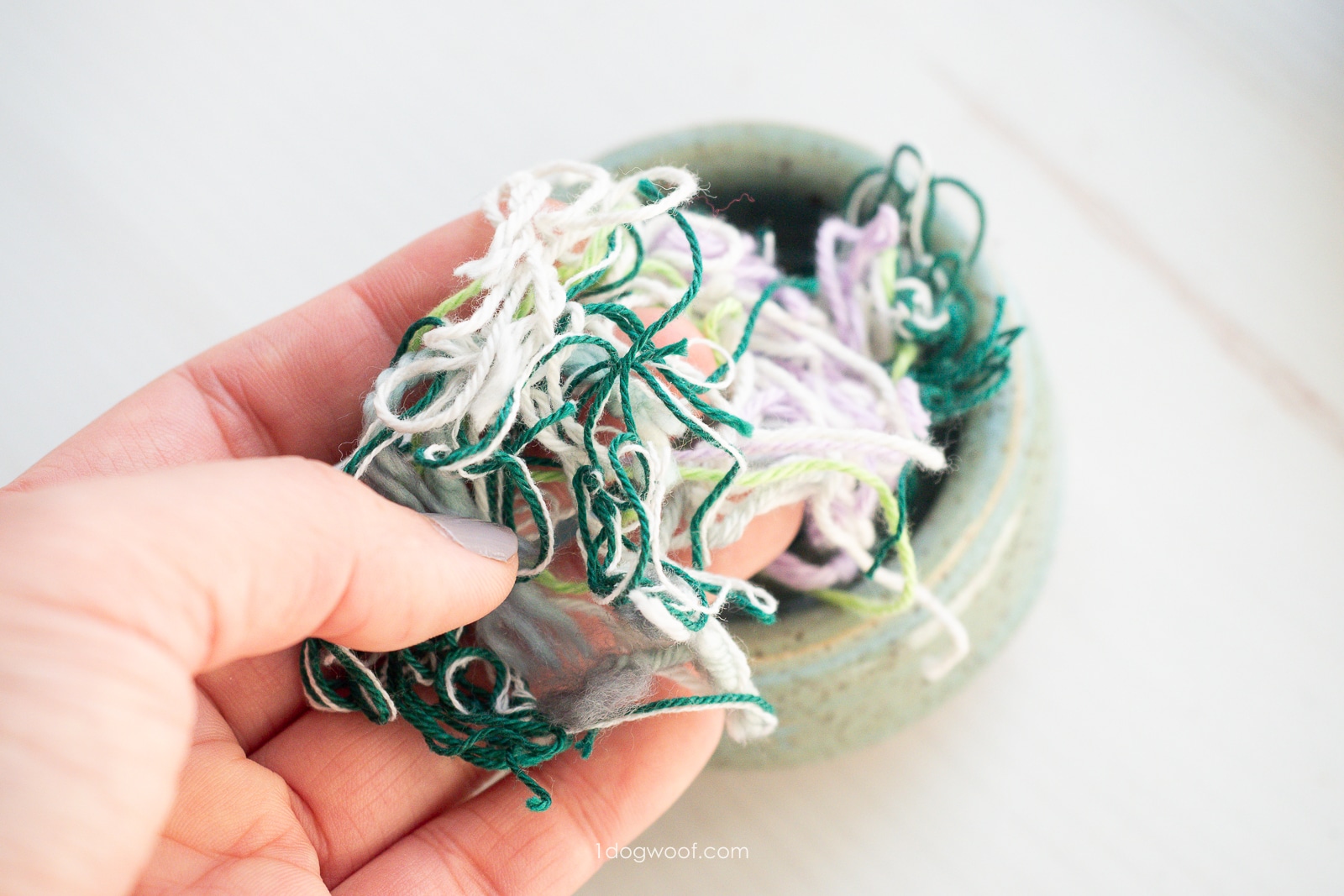 Sample of yarn scraps in left hand